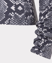 Load image into Gallery viewer, Close-up of snake print fabric and ruched sleeve against a white background.