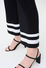 Load image into Gallery viewer, A gorgeous pant that will take you from day to evening, our Tatum trim detail pant in a striking black and white contrast, essentially pairs perfectly with so many of your favorite solid tops. A flared cut and contrast white trim create an eye-catching design that is not only fashionable but also flattering. Colors - Black and vanilla. Pull-on style. Elastic waist. No pockets.