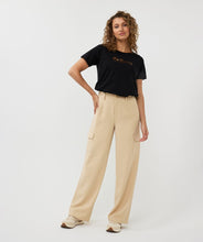 Load image into Gallery viewer, Constructed with cargo pockets and a trendy wide leg fit, these Tanner Trousers from EsQualo offer both comfort and style. The tan (sand) color complements most tops and the elastic waistband ensures a comfortable fit. Perfect for any fashion-forward wardrobe.