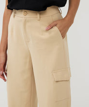 Load image into Gallery viewer, Constructed with cargo pockets and a trendy wide leg fit, these Tanner Trousers from EsQualo offer both comfort and style. The tan (sand) color complements most tops and the elastic waistband ensures a comfortable fit. Perfect for any fashion-forward wardrobe.