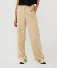Load image into Gallery viewer, Constructed with cargo pockets and a trendy wide leg fit, these Tanner Trousers from EsQualo offer both comfort and style. The tan (sand) color complements most tops and the elastic waistband ensures a comfortable fit. Perfect for any fashion-forward wardrobe.