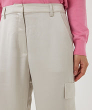 Load image into Gallery viewer, Upgrade your wardrobe with these stylish cargo trousers in a sophisticated light stone color. The satin finish adds a touch of elegance, making these trousers perfect for both casual and semi-formal occasions. Designed with a comfortable fit and versatile style, they can be paired effortlessly with sneakers for a relaxed look or heels for a chic, polished outfit.