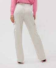 Load image into Gallery viewer, Upgrade your wardrobe with these stylish cargo trousers in a sophisticated light stone color. The satin finish adds a touch of elegance, making these trousers perfect for both casual and semi-formal occasions. Designed with a comfortable fit and versatile style, they can be paired effortlessly with sneakers for a relaxed look or heels for a chic, polished outfit.