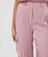 Load image into Gallery viewer, Slide into summer with these effortlessly chic silky cargos by EsQualo. Crafted in a soft pastel pink, they blend utility and elegance with a lightweight, flowy silhouette. Featuring an elastic waistband, side patch pockets, and a breezy wide-leg cut, these trousers are perfect for sunny strolls, weekend getaways, or dressing up with a strappy heel.