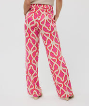 Load image into Gallery viewer, The EsQualo Taimi Trousers Disco Spark are a bold and stylish statement piece designed for effortless elegance. Featuring a vibrant pink-orange disco spark print, these trousers bring energy and sophistication to any outfit. Pair with a fitted top for a sleek contrast or a matching blouse for a coordinated ensemble.