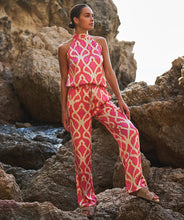 Load image into Gallery viewer, The EsQualo Taimi Trousers Disco Spark are a bold and stylish statement piece designed for effortless elegance. Featuring a vibrant pink-orange disco spark print, these trousers bring energy and sophistication to any outfit. Pair with a fitted top for a sleek contrast or a matching blouse for a coordinated ensemble.