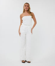 Load image into Gallery viewer, Step into elegance with the Tania Trousers by EsQualo, where soft off-white tones and delicate floral embroidery create a look that’s both timeless and fresh. Designed to flatter with a straight-leg silhouette and clean front closure, these trousers bring femininity to the everyday—perfect for garden brunches, summer soirées, or styled into fall with cozy knits and boots.