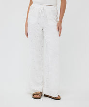 Load image into Gallery viewer, Step into elegance with the Tania Trousers by EsQualo, where soft off-white tones and delicate floral embroidery create a look that’s both timeless and fresh. Designed to flatter with a straight-leg silhouette and clean front closure, these trousers bring femininity to the everyday—perfect for garden brunches, summer soirées, or styled into fall with cozy knits and boots.