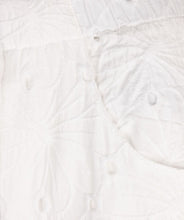 Load image into Gallery viewer, Step into elegance with the Tania Trousers by EsQualo, where soft off-white tones and delicate floral embroidery create a look that’s both timeless and fresh. Designed to flatter with a straight-leg silhouette and clean front closure, these trousers bring femininity to the everyday—perfect for garden brunches, summer soirées, or styled into fall with cozy knits and boots.