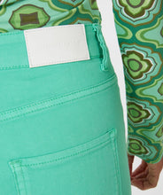 Load image into Gallery viewer, Color, color and more color! A beautiful flair basic denim pant in a striking jade green color is a must-have this season. These pants taper to a wider leg and functional five pockets. Color- Jade green. Tapers to wider leg. Functional five pockets. Silver buttons and hardware. EsQualo Jeans label. Fabric-97% Cotton. 3% Spandex.