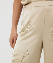 Load image into Gallery viewer, From brunch to cocktail hour, these shimmer-ready trousers are made to shine. The Sherica Sequin Trousers in Champagne feature a flattering high-rise elastic waistband, straight-leg cut, and allover micro-sequin embellishment for a dose of confidence and glam. Fully lined for comfortable wear, they’re ideal for dressing up—or dressing boldly.