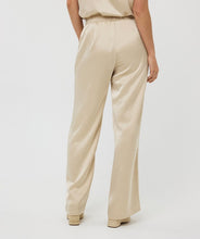 Load image into Gallery viewer, From brunch to cocktail hour, these shimmer-ready trousers are made to shine. The Sherica Sequin Trousers in Champagne feature a flattering high-rise elastic waistband, straight-leg cut, and allover micro-sequin embellishment for a dose of confidence and glam. Fully lined for comfortable wear, they’re ideal for dressing up—or dressing boldly.