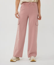 Load image into Gallery viewer, These trousers bring a perfect blend of style and functionality with their wide-leg cargo design. Tailored for versatility, they feature a relaxed yet chic fit, making them ideal for both casual days and elevated occasions. The charming chalk pink color adds a soft, feminine touch, while the high-quality fabric ensures lasting comfort and durability. With practical cargo-style pockets, these trousers strike the perfect balance between utility and fashion.