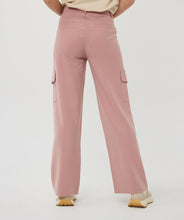 Load image into Gallery viewer, These trousers bring a perfect blend of style and functionality with their wide-leg cargo design. Tailored for versatility, they feature a relaxed yet chic fit, making them ideal for both casual days and elevated occasions. The charming chalk pink color adds a soft, feminine touch, while the high-quality fabric ensures lasting comfort and durability. With practical cargo-style pockets, these trousers strike the perfect balance between utility and fashion.