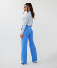 Load image into Gallery viewer, These beautiful electric blue wide leg trousers are adorned with clean pleated seams on the front and back, giving off a sophisticated and refined appearance. The elastic waistband allows for a comfortable and flattering fit. Suitable for both casual and formal events, these trousers make a versatile wardrobe addition.