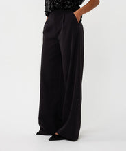 Load image into Gallery viewer, Black pants, black heels, and black sequin top worn by a model against a white background.