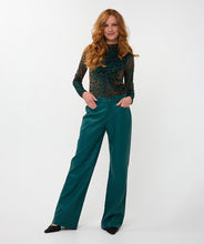 Load image into Gallery viewer, Woman wearing a teal and brown velvet burnout top, teal wide-leg pants and black heels against a white background.