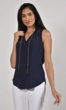 Load image into Gallery viewer, The Frank Lyman Style 221025 top features a beautiful dark navy color, aptly named Twilight. It also includes a detachable necklace adorned with gold, navy and gold beads, as well as a fringe of twilight navy. The neckline and bottom of the top feature delicate ruffle details, adding an extra touch of intrigue. A versatile and stylish choice for any occasion.