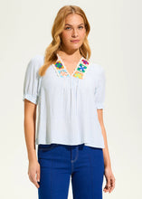 Load image into Gallery viewer, A little boho charm, a little classic elegance—this blouse is the perfect blend of effortless style and refined details. The delicate crochet trim adds a touch of artistry, while the soft blue stripes bring a timeless appeal. Whether you're dressing for a sunny brunch, a casual workday, or a weekend getaway, this top is your go-to for laid-back sophistication.