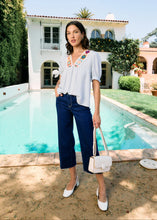 Load image into Gallery viewer, A little boho charm, a little classic elegance—this blouse is the perfect blend of effortless style and refined details. The delicate crochet trim adds a touch of artistry, while the soft blue stripes bring a timeless appeal. Whether you're dressing for a sunny brunch, a casual workday, or a weekend getaway, this top is your go-to for laid-back sophistication.