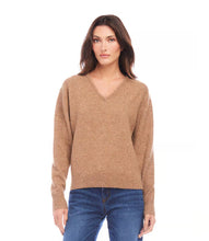 Load image into Gallery viewer, Cozy up in this soft V-neck sweater. Perfect for lounging or a casual day out. A wardrobe staple that's anything but basic.