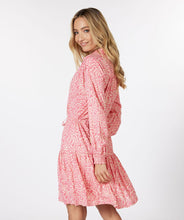 Load image into Gallery viewer, If you love pink, you'll love this darling dress by EsQualo! Not only is the color stunning, but the detailing is high end. A lace edging runs down the front button closure, creating an eye-appealing addition while the subtle tiered bottom and elasticized cuffs add even more interest. The belt in tie allows for cinching at the waist and button-down top portion includes pink buttons. Colors- Pink and cream. Button-down top portion. Built in tie waist. Subtle tiered bottom. Elasticized sleeves.
