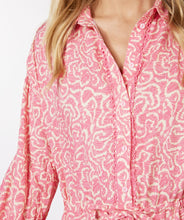 Load image into Gallery viewer, If you love pink, you'll love this darling dress by EsQualo! Not only is the color stunning, but the detailing is high end. A lace edging runs down the front button closure, creating an eye-appealing addition while the subtle tiered bottom and elasticized cuffs add even more interest. The belt in tie allows for cinching at the waist and button-down top portion includes pink buttons. Colors- Pink and cream. Button-down top portion. Built in tie waist. Subtle tiered bottom. Elasticized sleeves.