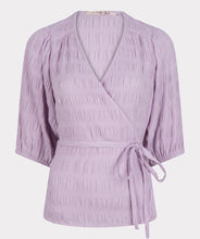 Load image into Gallery viewer, Equalize your fashion game with this stylish seersucker blouse in a show stopping violet. The wrap style and billowy elasticized elbow sleeves are perfect for creating a flattering silhouette. With its modern look and timeless quality, you'll be turning heads for seasons to come.