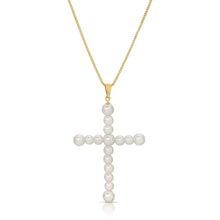 Load image into Gallery viewer, Our Vivian Pearl Cross Necklace is an attention grabber with its gorgeous array of faux pearls in a cross design. A bold piece to wear alone or layer with your favorite necklaces, this will become one of your favorite go to necklaces. Color- Gold and white. Faux pearls. Twenty inch box chain. 14 kt gold plate over brass.