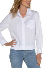 Load image into Gallery viewer, The Winslow White Button Front Shirt features a new elastic back waist to enhance any figure and ensure optimal comfort. This modern interpretation of a timeless piece makes it a must-have for any wardrobe. Color- White. Button front shirt.. Elastic at back waist. Long sleeve.
