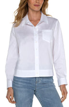 Load image into Gallery viewer, The Winslow White Button Front Shirt features a new elastic back waist to enhance any figure and ensure optimal comfort. This modern interpretation of a timeless piece makes it a must-have for any wardrobe. Color- White. Button front shirt.. Elastic at back waist. Long sleeve.