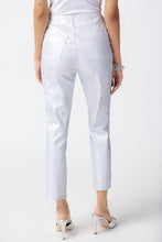 Load image into Gallery viewer, These high-quality denim jeans feature a classic and elegant design with a shimmering foil animal print. The slim crop silhouette provides versatility, while the hidden elastic waistband ensures comfort and security. Color- White and silver. Foiled twill. Hidden elastic waistband. Two back pockets. Unlined.