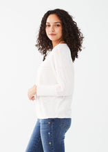 Load image into Gallery viewer, Expertly styled, this batwing top boasts a comfortable and fashion-forward design, featuring a relaxed and airy silhouette for a versatile and modern addition to your wardrobe. Adorning the sides of each sleeve are charming pastel palm trees intricately embroidered for an extra touch of style. Color- White with pastel colors. Length 24". Round neck. Embroidery details on sleeves. Ribbed cuffs. Batwing style.
