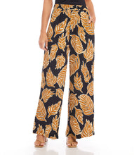 Load image into Gallery viewer, Immerse yourself in the luxury of these pants, expertly made from a premium blend of viscose for a silky-smooth feel against your skin. The wide-leg silhouette provides a flattering and flowy fit, ensuring both comfort and a chic appearance.