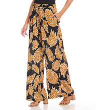 Load image into Gallery viewer, Immerse yourself in the luxury of these pants, expertly made from a premium blend of viscose for a silky-smooth feel against your skin. The wide-leg silhouette provides a flattering and flowy fit, ensuring both comfort and a chic appearance.