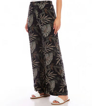 Load image into Gallery viewer, Channeling the free-spirited vibe of bohemian style, these soft pants boast a charming dotted leaf pattern that brings a whimsical flair to any outfit. Convenient side pockets and a wide-leg design provide both style and comfort, making them perfect for relaxed days at home or adventurous outings.
