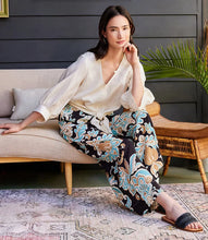 Load image into Gallery viewer, Step into effortless sophistication with the Wryn Wide Leg Pants in Damask Floral Print by Karen Kane. These elegant pants feature a stunning damask floral design in soft brown and blue hues, adding a touch of refinement to your wardrobe. The wide-leg silhouette creates a flattering and modern look, while the elasticized waist and convenient side pockets ensure practicality without compromising elegance.