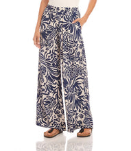Load image into Gallery viewer, Whether you are on vacation or simply enjoying warmer days, these wide pants are the perfect choice. Crafted from crepe material, these pants showcase a whimsical paisley print for a playful touch. The flowy design ensures both movement and comfort. Experience a relaxed yet stylish appearance with these pants.