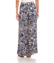 Load image into Gallery viewer, Whether you are on vacation or simply enjoying warmer days, these wide pants are the perfect choice. Crafted from crepe material, these pants showcase a whimsical paisley print for a playful touch. The flowy design ensures both movement and comfort. Experience a relaxed yet stylish appearance with these pants.
