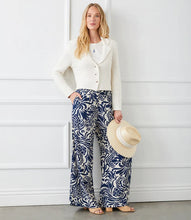 Load image into Gallery viewer, Whether you are on vacation or simply enjoying warmer days, these wide pants are the perfect choice. Crafted from crepe material, these pants showcase a whimsical paisley print for a playful touch. The flowy design ensures both movement and comfort. Experience a relaxed yet stylish appearance with these pants.