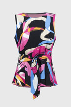 Load image into Gallery viewer, Add a touch of bold sophistication to your wardrobe with the Joseph Ribkoff Woven Abstract Print Top. Featuring a sleeveless design, scoop neckline, and an elegant front sash, this standout piece combines vibrant style with unmatched comfort. The striking abstract print is perfect for spring and summer.