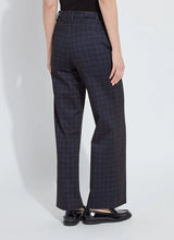 Load image into Gallery viewer, Model wearing dark plaid pants and black loafers against a white background.