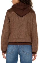 Load image into Gallery viewer, Introducing our new trucker jacket, complete with a detachable hood. The rich, earthy hue enhances the faux leather material, adding a layer of sophistication. This versatile and chic jacket is an indispensable addition to the wardrobe of any contemporary explorer.