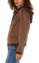 Load image into Gallery viewer, Introducing our new trucker jacket, complete with a detachable hood. The rich, earthy hue enhances the faux leather material, adding a layer of sophistication. This versatile and chic jacket is an indispensable addition to the wardrobe of any contemporary explorer.