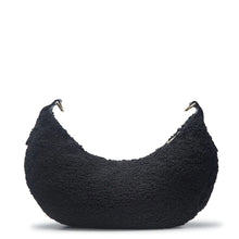 Load image into Gallery viewer, The unique moon-shaped Zola bag is now accented with a Vegan Sherpa Body adding the perfect amount of texture to your everyday bag! This bag has a curved silhouette and is accented with an adjustable braided vegan leather strap. Including a pull zipper closure on the top of the bag, interior zip, and open interior pockets. Wear the Zola as a crossbody with its adjustable braided strap or as a shoulder bag. Color- Black.