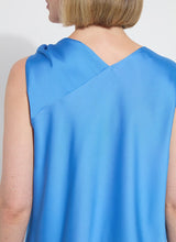 Load image into Gallery viewer, The Zulena Bow-Tie Neck Top in vibrant Electric Blue is a true wardrobe essential for fashion-forward individuals. Designed with a straight, cropped fit that runs true to size, this sleeveless top is crafted from luxurious Soft Touch Satin for a smooth, elegant feel. Cut on the bias for a flattering drape, it features stylish details such as a diagonal back seam, chic side slits, and an adjustable shoulder tie, making it the perfect blend of comfort and sophistication.