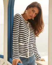 Load image into Gallery viewer, Experience comfort and style with this essential addition for a sophisticated appearance. Wear it unbuttoned over your preferred top or buttoned up for a refined look. The classic white and navy stripes offer a timeless appeal. Easily dressed up or down for any occasion. Color- White and navy stripe. Front button closure. Round neck. Long sleeves.