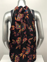 Load image into Gallery viewer, A beautiful black base with vibrant neon floral pattern in lime green, yellow, purple, turquoise and orange creates a stunning mock neck top. A dramatic finishing touch is a tie at the base of the neck. With a fabric that is soft and cool to the touch, you will not only be stylish but comfortable at the same time.