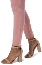 Load image into Gallery viewer, Liverpool's classic Abby Skinny is now in a color that we just adore! A beautiful vibrant wash in rose blush color just catches the eye! With its amazing stretch and recovery, this Abby Skinny will easily become one of your favorites. Pair with your choice of top and sandal for a perfect spring/summer outfit. Color- Rose Blush. Mid-rise. Cut hem. Amazing stretch and recovery.