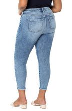 Load image into Gallery viewer, One of Liverpool's signature crop jeans, the Abby Skinny is known for the wonderful fit and recovery, preventing baggy jeans at the end of the day. With a slight fray hem detailing at the bottom of the legs, the Abby is not only comfortable but also stylish. Color-Emmett. 27” Inseam. Mid-rise. Fray hem detail. Amazing stretch and recovery.